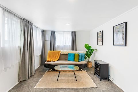 Turquoise, mustard and green tones provide some colour in this white room.