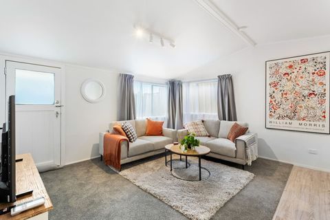 The lounge is inviting with its lovely artwork, neutral tones and accents of orange.