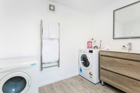 With the washing machine and dryer located in the bathroom, it is convenient to put on a load of washing.