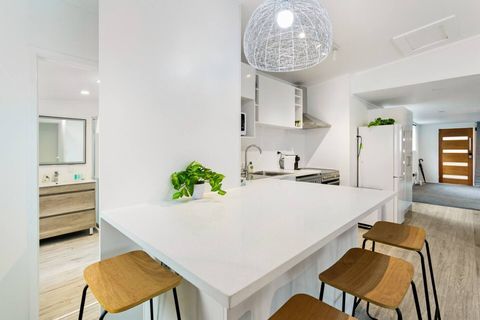 The bar seating provides an area for eating, working or chatting to the cook.