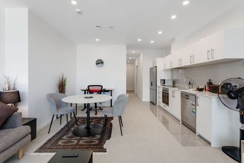 View from the balcony area to the front door showcasing the open-plan living.