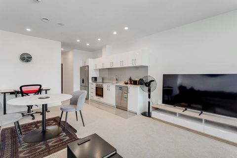 Watch TV on the large-screen smart TV.