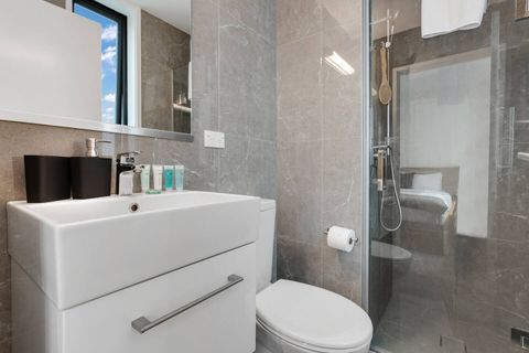 Ensuite bathroom with shower, toilet and basin.