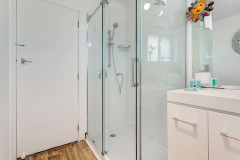 The family bathroom has a modern shower and vanity unit.