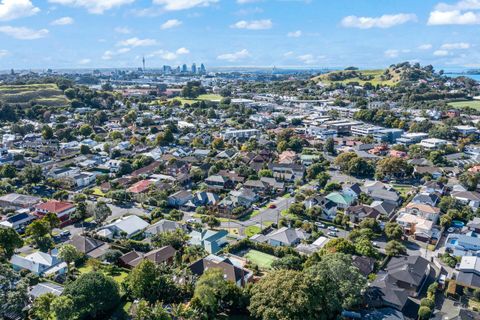 The house is centrally located, and Auckland CBD is in the distance.