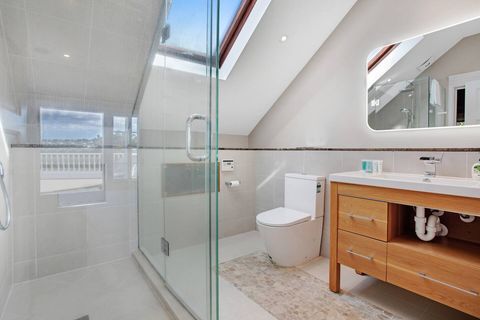 The main bedroom's ensuite bathroom has a great shower, vanity and toilet.