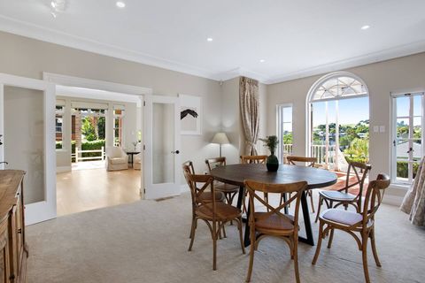 This dining area goes through to the kitchen and lounge areas.