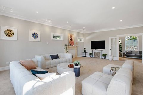 Relax on the couch, watch TV, or read a book in this light lounge room.