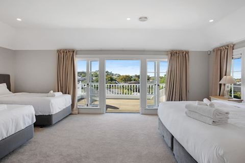 The main bedroom suite has a King Bed and two King Single beds. There is also a walk-in wardrobe and ensuite bathroom.