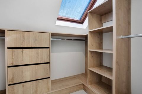 The walk-in wardrobe has lots of storage for all your belongings.