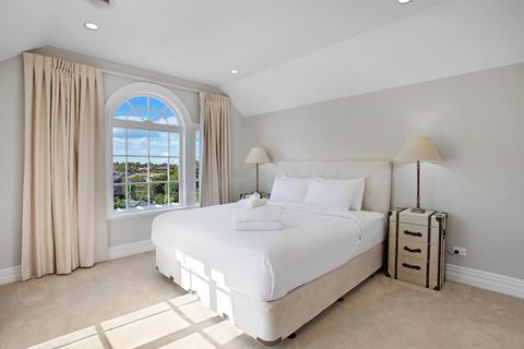 Relax in the king bed while enjoying the view out through the arched window.