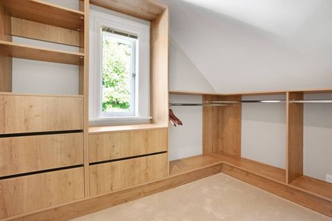 The main bedroom walk-in wardrobe has plenty of space for your belongings.