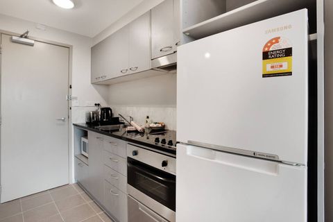 The kitchen has a cook top, oven, dishwasher, fridge/freezer and microwave.