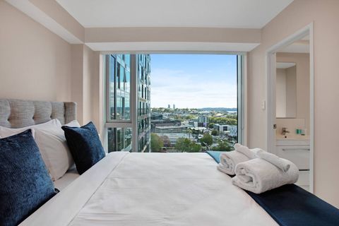 The white sheets invite you to rest and relax in this comfy bed.