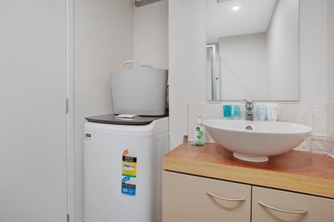 The washing machine is also in the main bathroom.