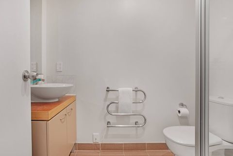 The main bathroom has a toilet, vanity and shower.