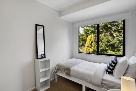 Lovely view of the outdoors through the large windows that lets in plenty of light.