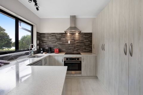 The kitchen has a cook top, oven, dishwasher, fridge/freezer and microwave.