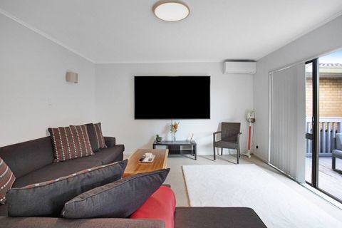 There is plenty of space on the L-shaped couch to relax and read a book.