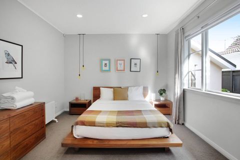 Plenty of natural light floods this bedroom, but it also drapes for nighttime.