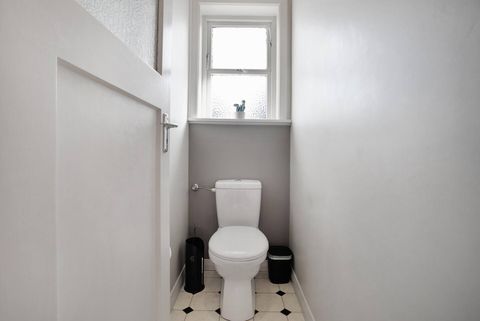 The separate toilet is right next to the bathroom.