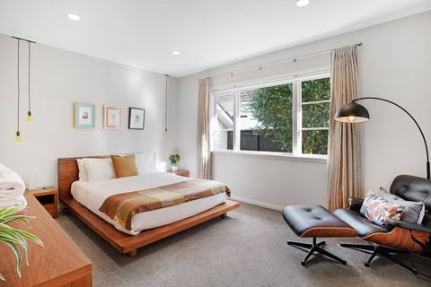 The main bedroom has a queen bed and a great chair for reading.