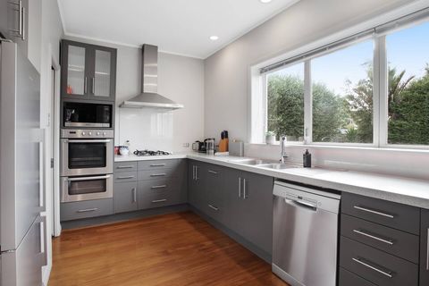 The kitchen has a gas hob, double oven, microwave, dishwasher and fridge/freezer.