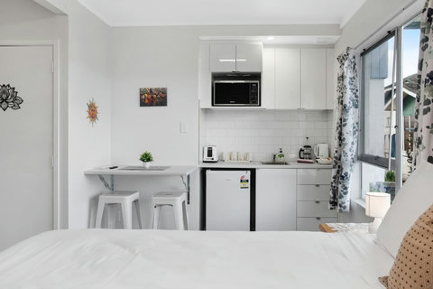 The kitchenette has a mini-fridge, microwave, toaster and kettle.