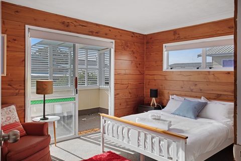 The Queen bed invites you into sleep with its crisp white hotel sheets.