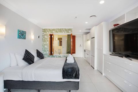 Lay in bed and watch TV on the large flatscreen TV.