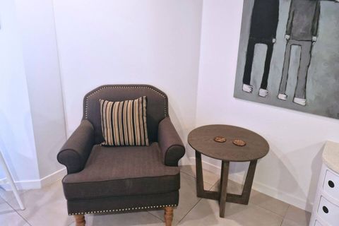 The chair is a great space to read a book or enjoy a beverage.