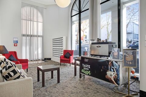 There is a comfortable lounge area in the foyer where you can also purchase a cup of coffee.