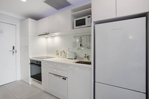 The kitchen has everything you need to cook, including an oven, cooktop, dishwasher, fridge/freezer, and microwave.