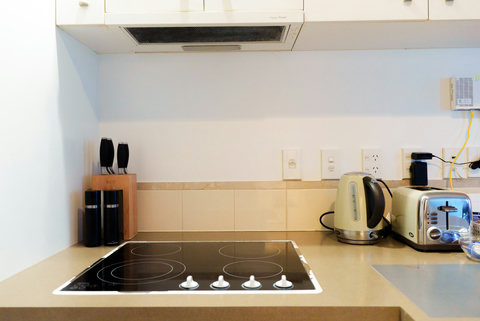 The stovetop with kettle and toaster are easily available on the countertop.