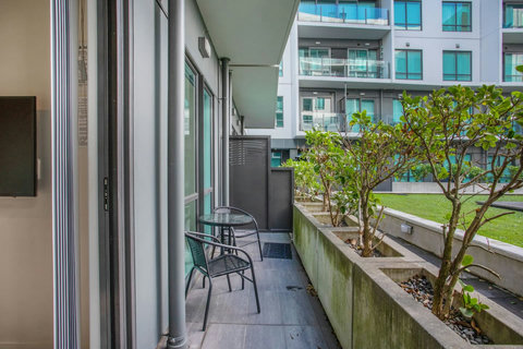 The patio area is cute and has access to both seating and the shared communal garden area.