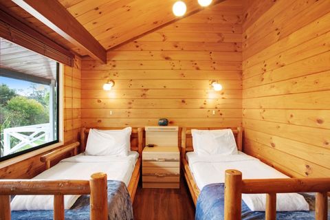 The wooden beds give this bedroom an alpine feeling - you could be in the woods somewhere.