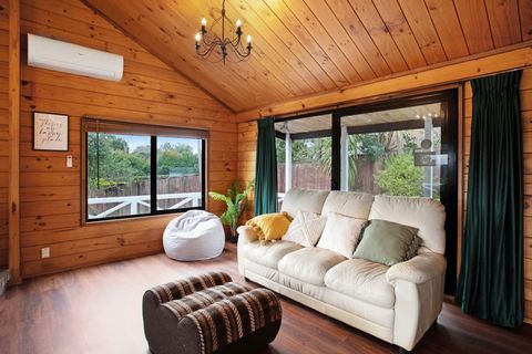 There is a cosy couch in front of the ranch-slider doors.