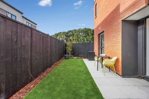 The backyard has a nice table and chairs to enjoy the sunshine.