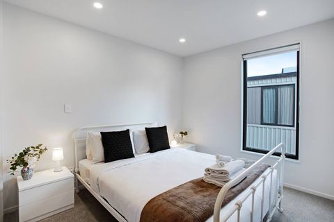 The Queen bed is inviting with its crisp white sheets and pops to colour.