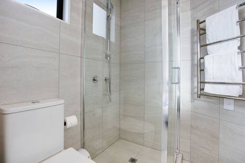 The ensuite bathroom has its own toilet, vanity and shower.
