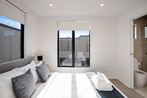 The bedroom has its own ensuite bathroom with toilet, shower, and vanity unit.