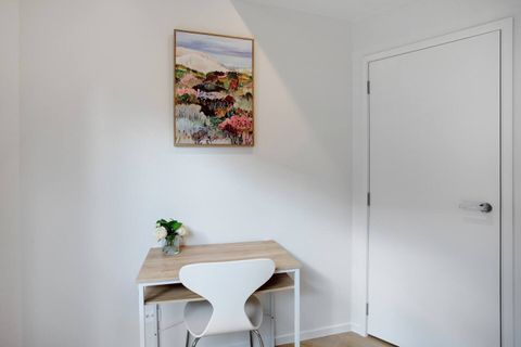 The office space has its own desk, chair and storage.