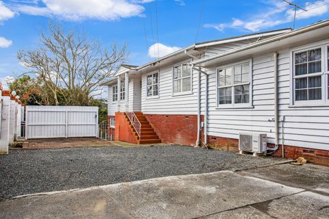 There is a parking pad with space for two cars.