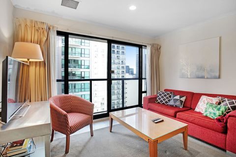 The living room is spacious with a coffee table and TV unit.