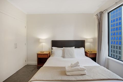 The Queen bedroom has neutral tones that invites a restful sleep.