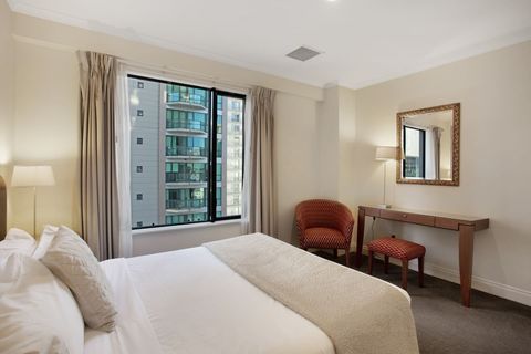 There is a handy chair and table in the room for your personal items.