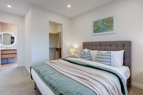 The main bedroom has a walk-in wardrobe and ensuite bathroom.