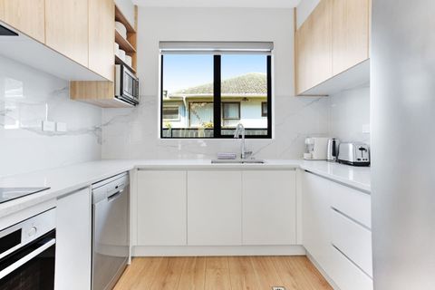 The kitchen has a cook top, oven, microwave, dishwasher and fridge/freezer.