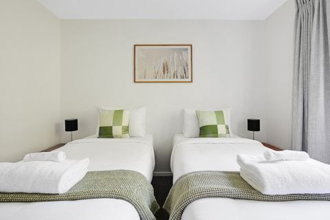 There are crisp white sheets and a colourful throws on the beds.