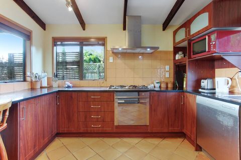 The kitchen has a oven, gas cook top, dishwasher, microwave and fridge/freezer.